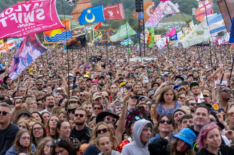GLASTONBURY, ENGLAND - JUNE 30: Music fans cheer as they watch a performance on the Other Stage during day five of Glastonbury Festival 2024 at Worthy Farm, Pilton on June 30, 2024 in Glastonbury, England. Founded by Michael Eavis in 1970, Glastonbury Festival features around 3,000 performances across over 80 stages. Renowned for its vibrant atmosphere and iconic Pyramid Stage, the festival offers a diverse lineup of music and arts, embodying a spirit of community, creativity, and environmental consciousness. The Glastonbury Festival is set to return in June 2025, before having a fallow year in 2026. (Photo by Matt Cardy/Getty Images)