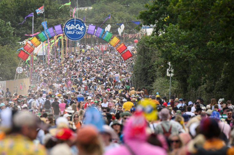 GLASTONBURY, ENGLAND - JUNE 27: Crowds of festival-goers fill one of the pathways during day two of Glastonbury Festival 2024 at Worthy Farm, Pilton on June 27, 2024 in Glastonbury, England. Founded by Michael Eavis in 1970, Glastonbury Festival features around 3,000 performances across over 80 stages. Renowned for its vibrant atmosphere and iconic Pyramid Stage, the festival offers a diverse lineup of music and arts, embodying a spirit of community, creativity, and environmental consciousness. (Photo by Leon Neal/Getty Images)