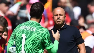 Alisson Becker and Arne Slot