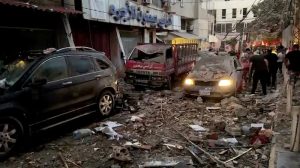  Aftermath of Israeli air strike in Beirut, Emergency responders at the site of the air strike, Hezbollah members in Dahieh area following the attack, UN Security Council session discussing escalating violence.