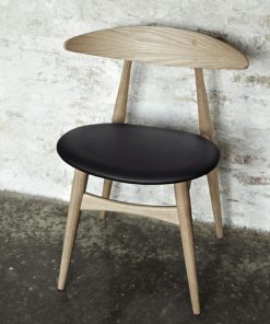 Carl Hanson and Sohn solid wood chair with simple and elegant lines. Upholstered seat.