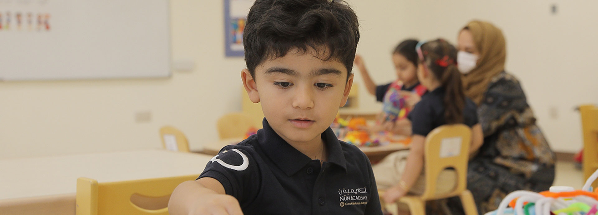 Lower primary school student working in class