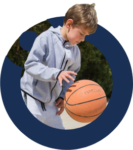 Student playing basketball at Nün Academy International School