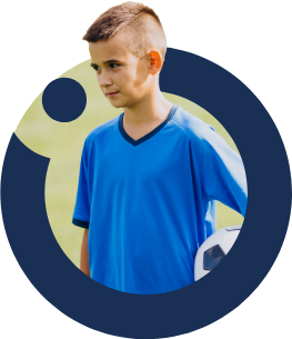 Student playing football at Nün Academy International School
