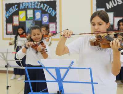 Students making music with instruments at Nün Academy International School