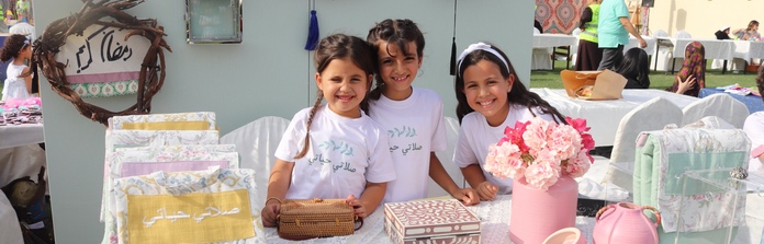 Students running a stall at the Ramadan Festival at Nün Academy International School