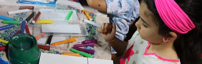 Student enjoying art activities at Nün Academy International School