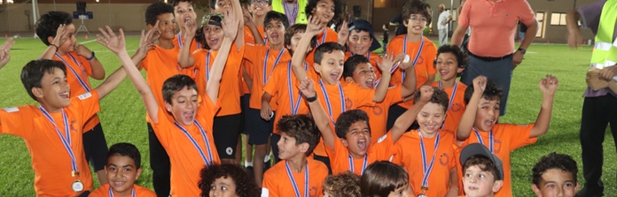 A sports team celebrating at Nün Academy International School