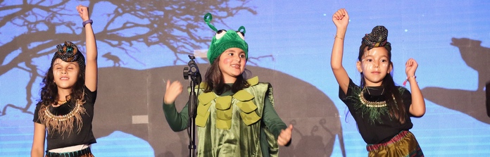 Nün Academy International School students performing on stage
