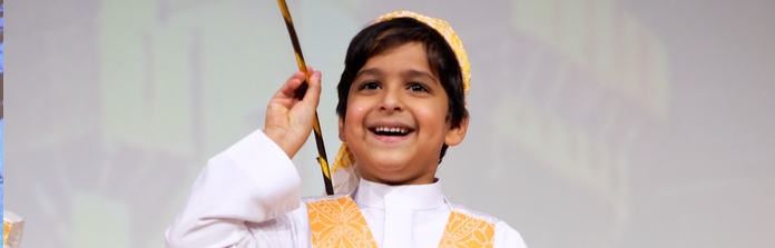 Nün Academy International School students performing on stage