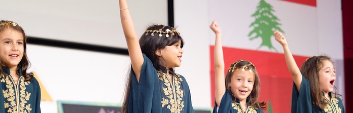 Nün Academy International School students performing on stage