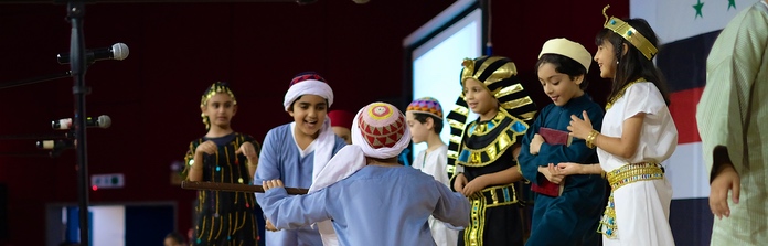 Nün Academy International School students performing on stage