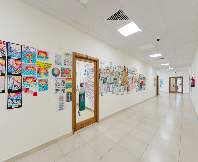 A colourful display of work completed by students in the corridors at Nün Academy International School