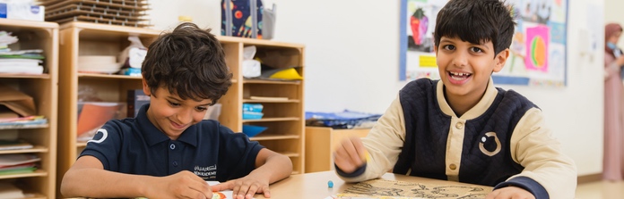 Students enjoying classroom work together at Nün Academy International School