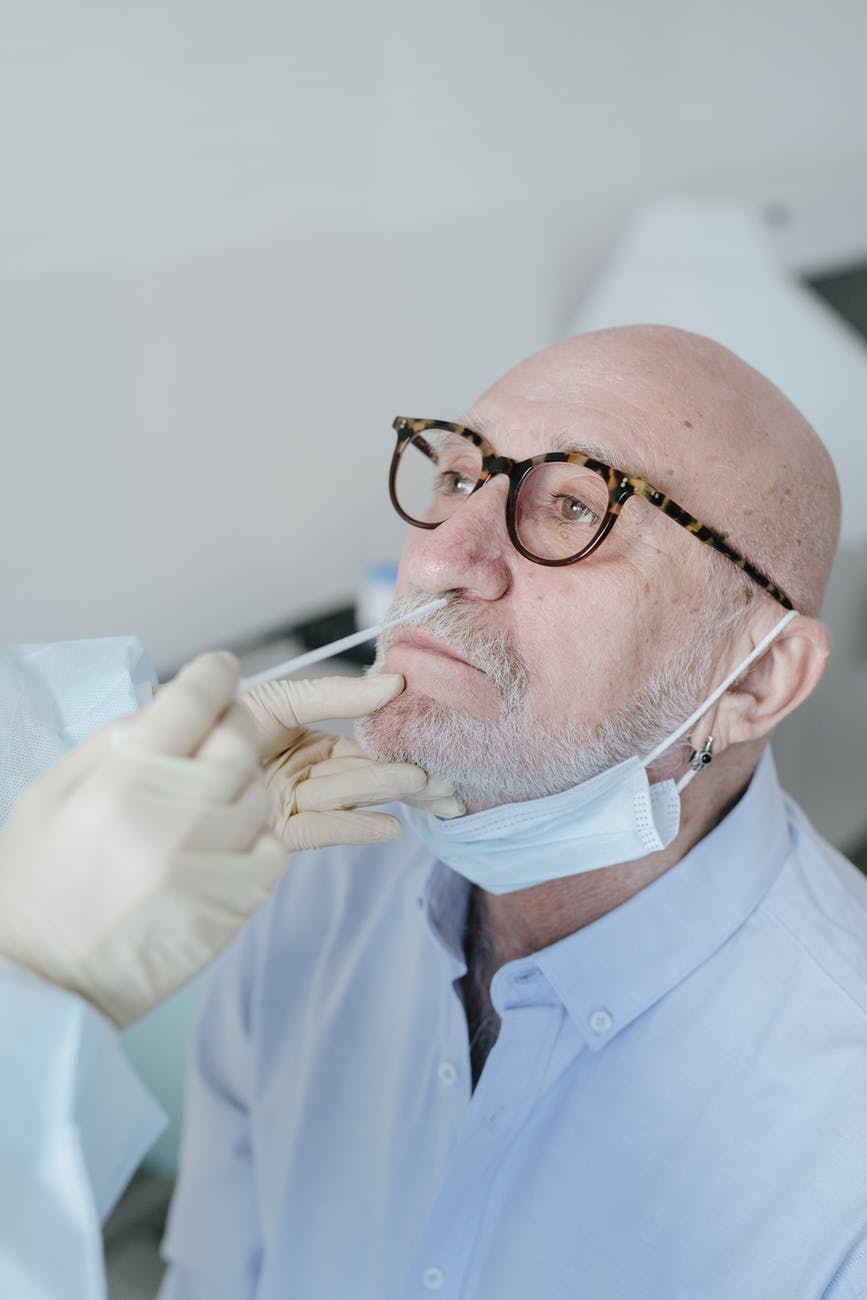 a person doing nasal swab test