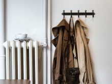 coats and shoulder bag on hooks in house