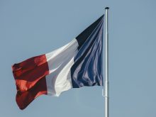 french flag against blue sky