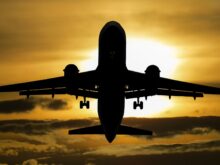 silhouette of airplane during sunset