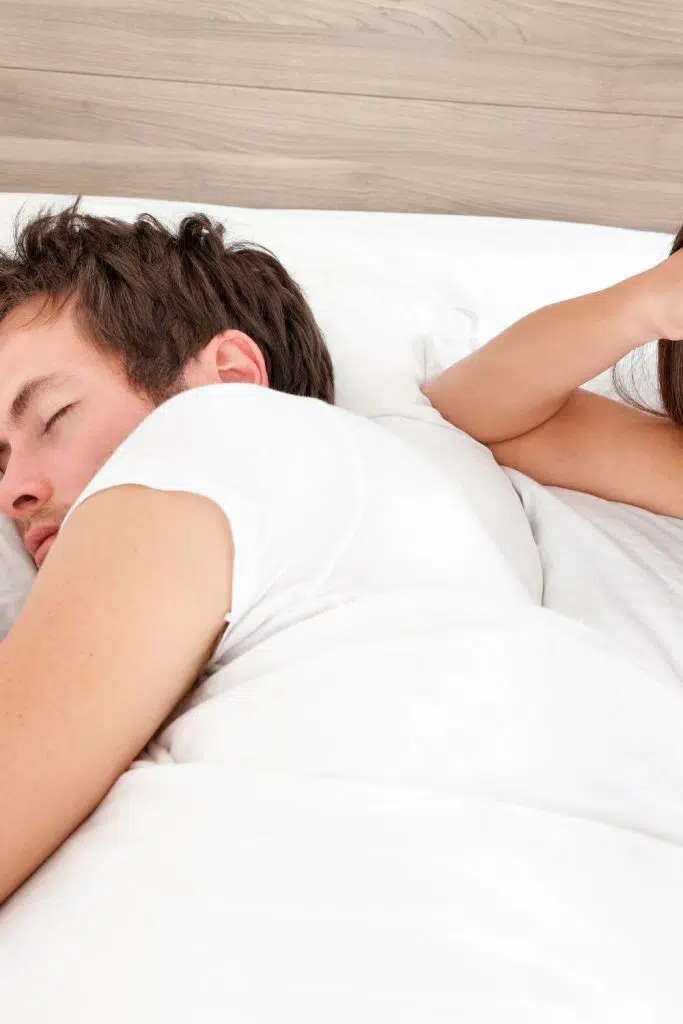 what does it mean when your husband sleeps with his back to you