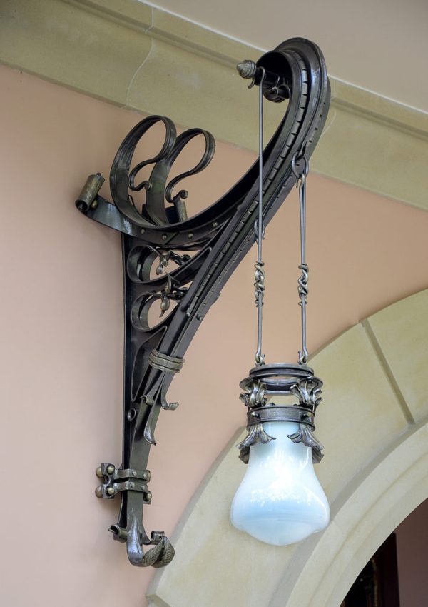 Artistic wrought iron pendant lamp with graceful curls