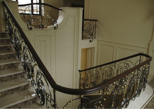Wrought iron balustrade with wooden handrail “Dance” detail overview