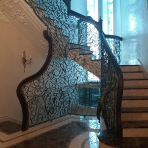 Wrought iron balustrade with wooden handrail “Spider web”