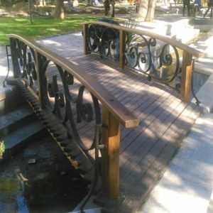 Wrought iron bridge railing with wood “Boslust”