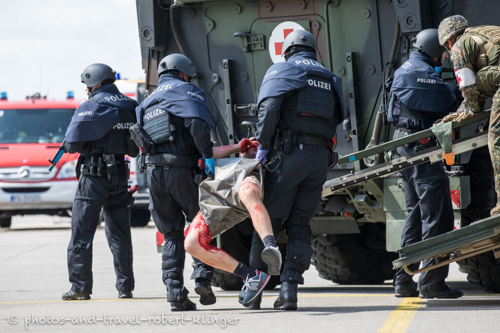 Police officials are carrying a injured perseon