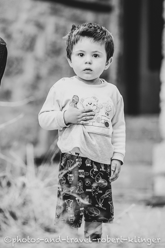 An albanian boy, A vendor in his shop in Albania, black and white photo