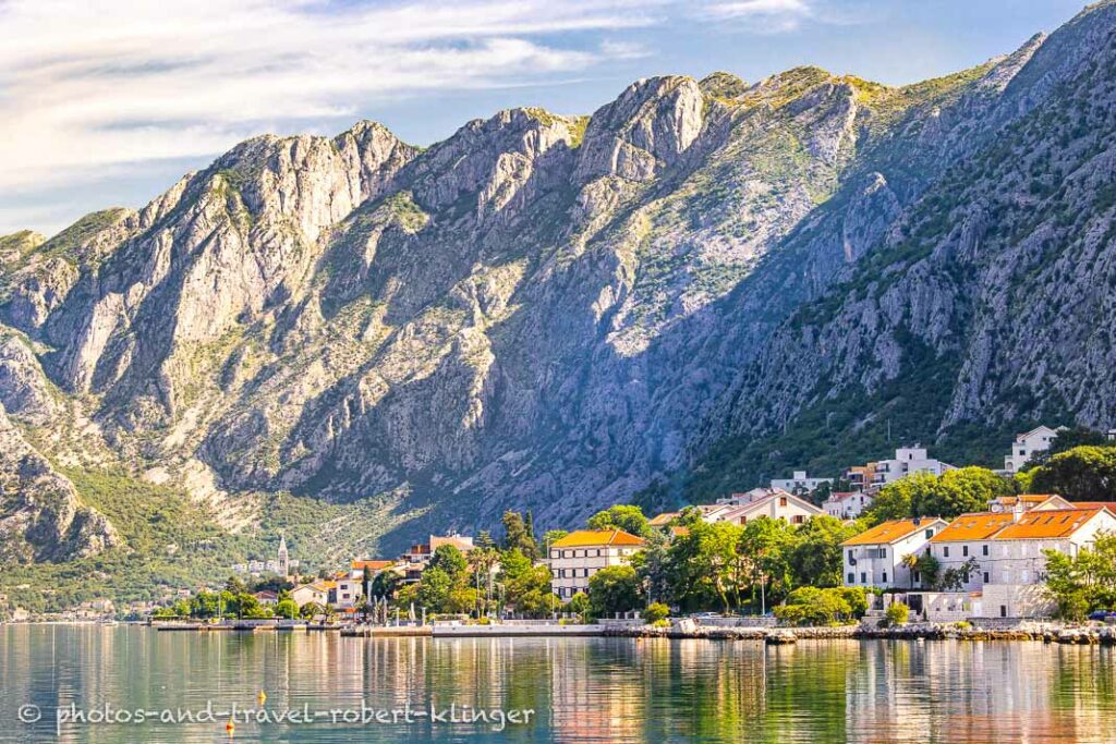 Steep mountains and houses along the bay of Kotor in Montenegro