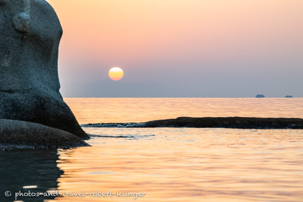 Long exposure photo of a beautiful limestone formation on a beach in Sithonia in Greece during sunrise