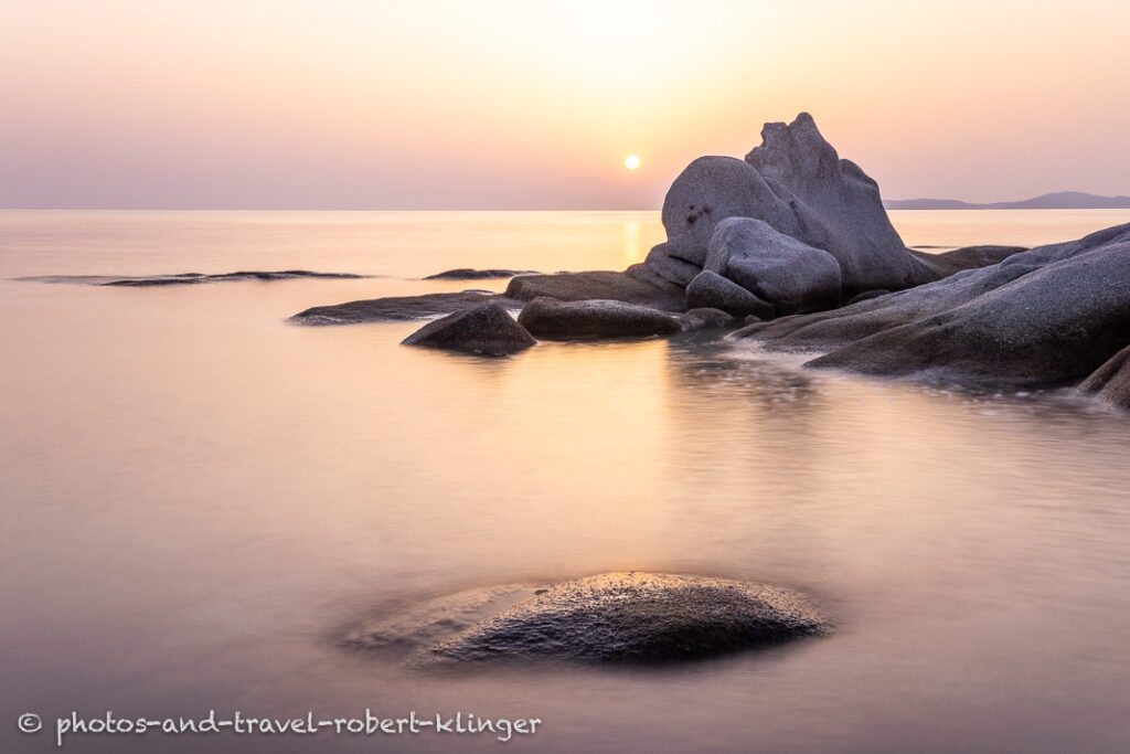 Long exposure photo of a beautiful limestone formation on a beach in Sithonia in Greece during sunrise