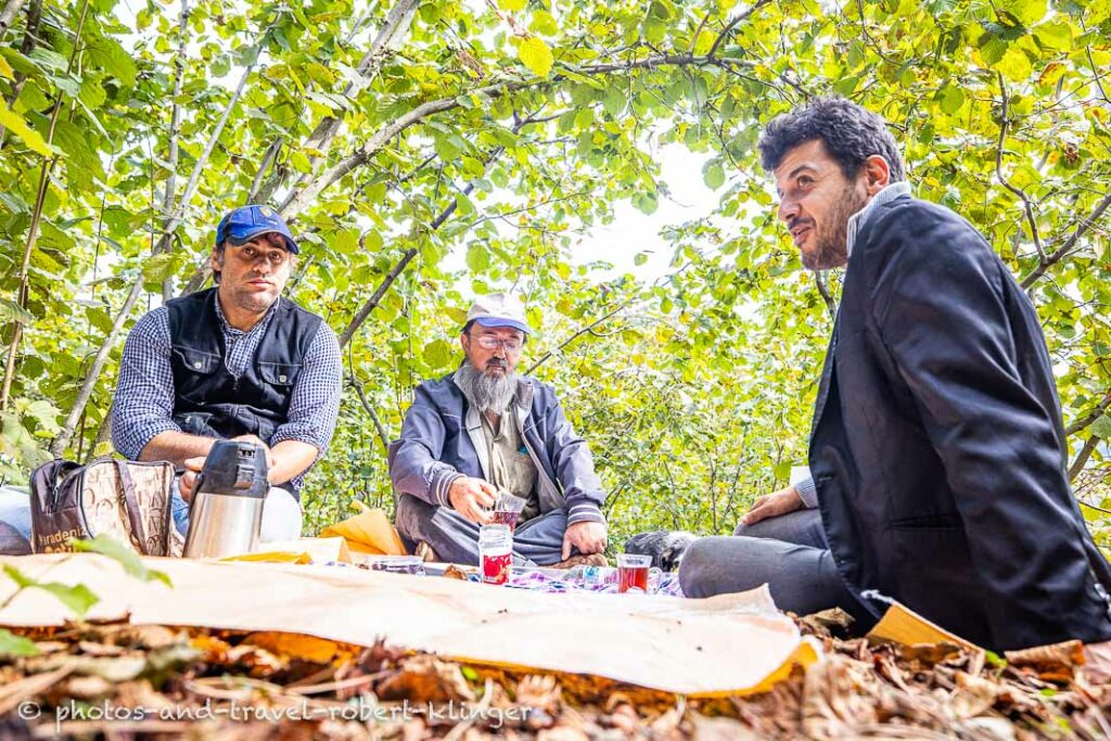 Three hazelnut worker having a rest after hard work