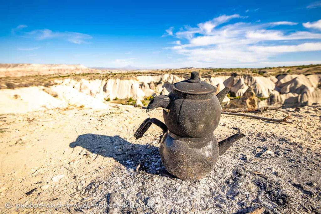 A tea pot at a fire pit in Cappadocia