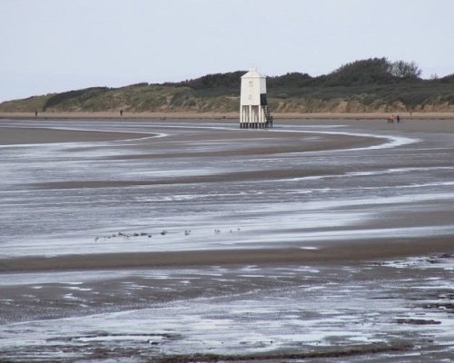 Burnham-on-sea Lighthouse Square wooden lighthouse stands in the middle of mudflats at Burnham On Sea