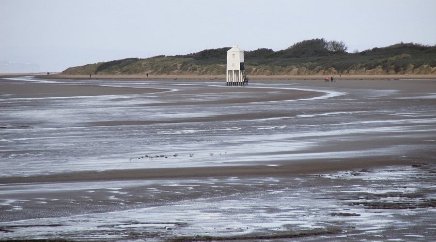 Burnham-on-sea Lighthouse Square wooden lighthouse stands in the middle of mudflats at Burnham On Sea