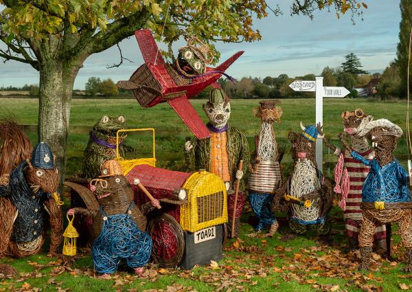 Coates English Willow Under a tree stands the characters from The Wind in the Willows that have been woven from the willow grown at Coates English Willow.