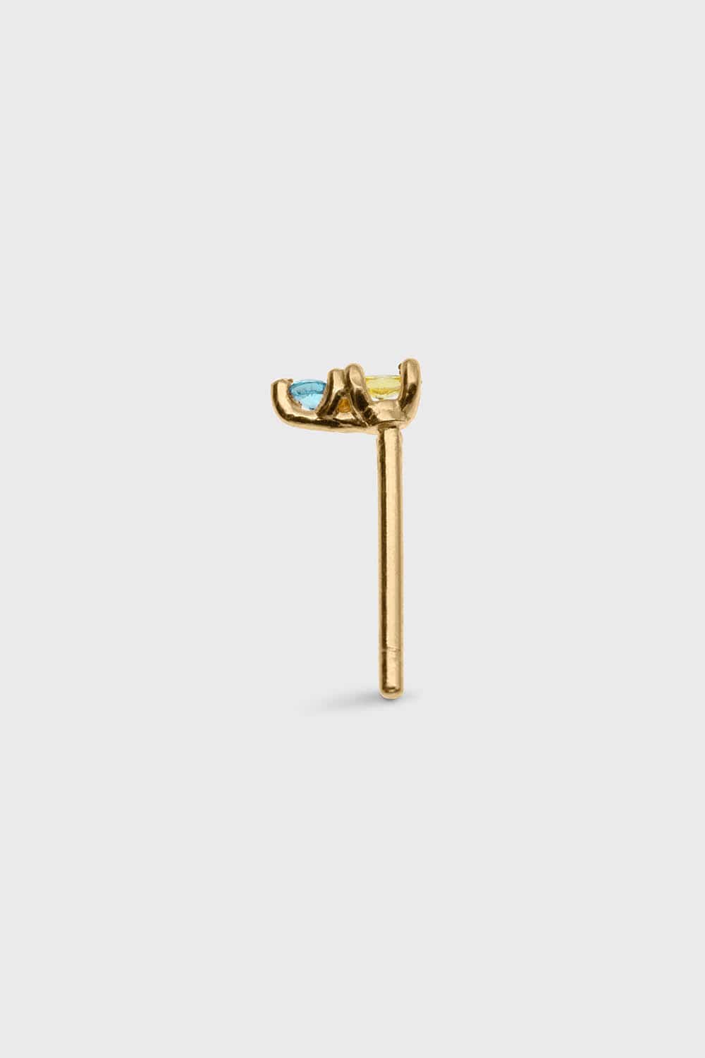 SIDE VIEW OF PLANCTOLOGY® DRIFTER 13. TINY 14K SOLID GOLD STUD EARRING WITH YELLOW AND BLUE STONES.