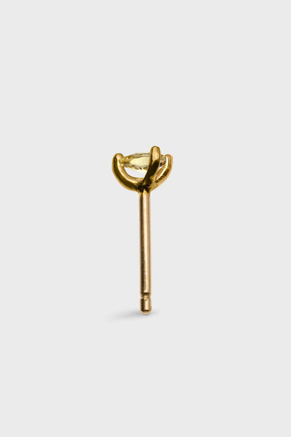 SIDE VIEW OF PLANCTOLOGY® DRIFTER 5. TINY 14K SOLID GOLD STUD EARRING WITH YELLOW DROP CUT STONE.