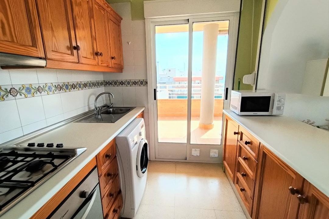 Full Kitchen With Microwave, Gas Stove, Oven, Washing Machine And Water Boiler