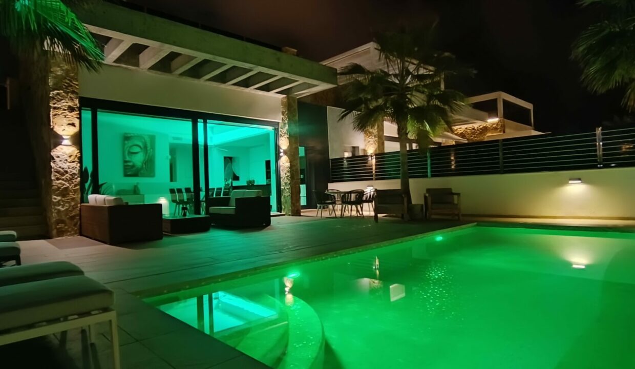 Pool and garden by night