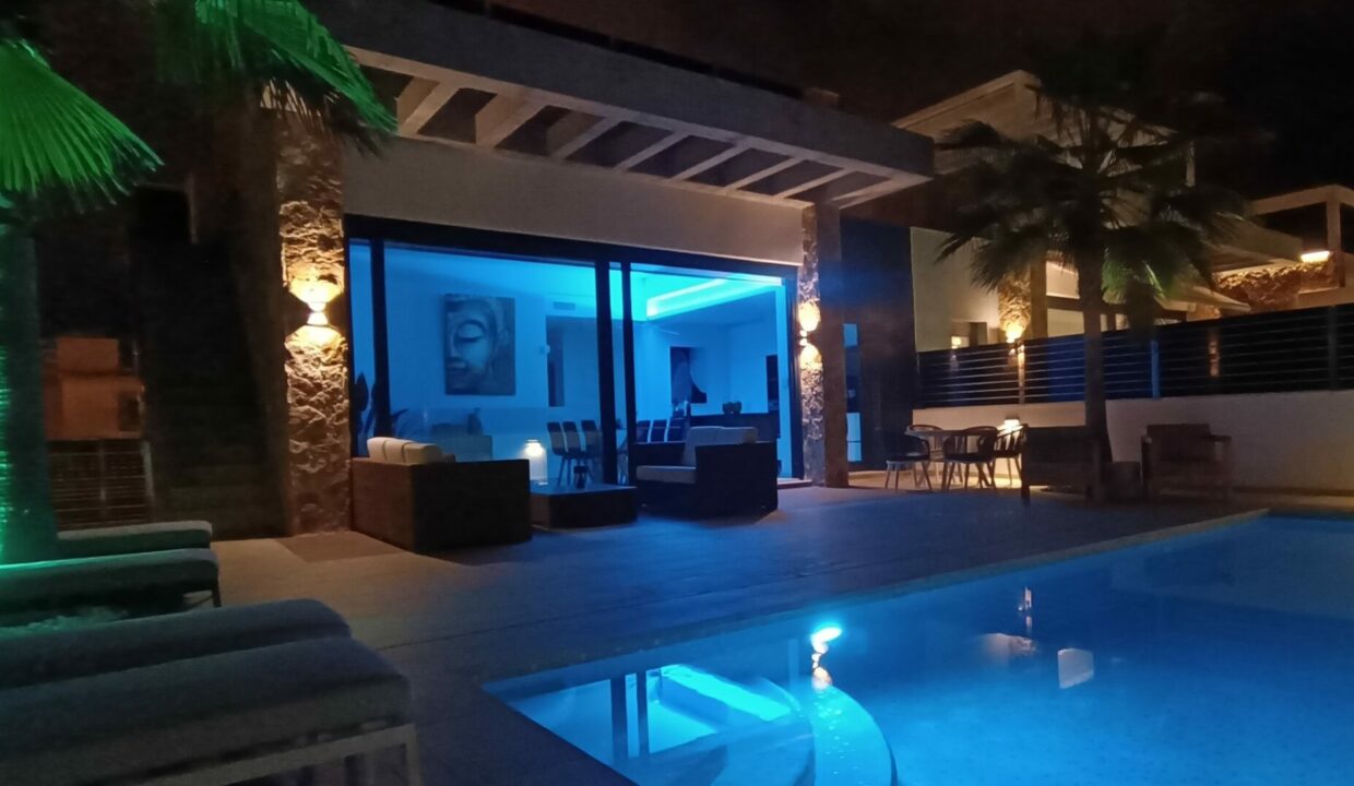 Pool and garden by night