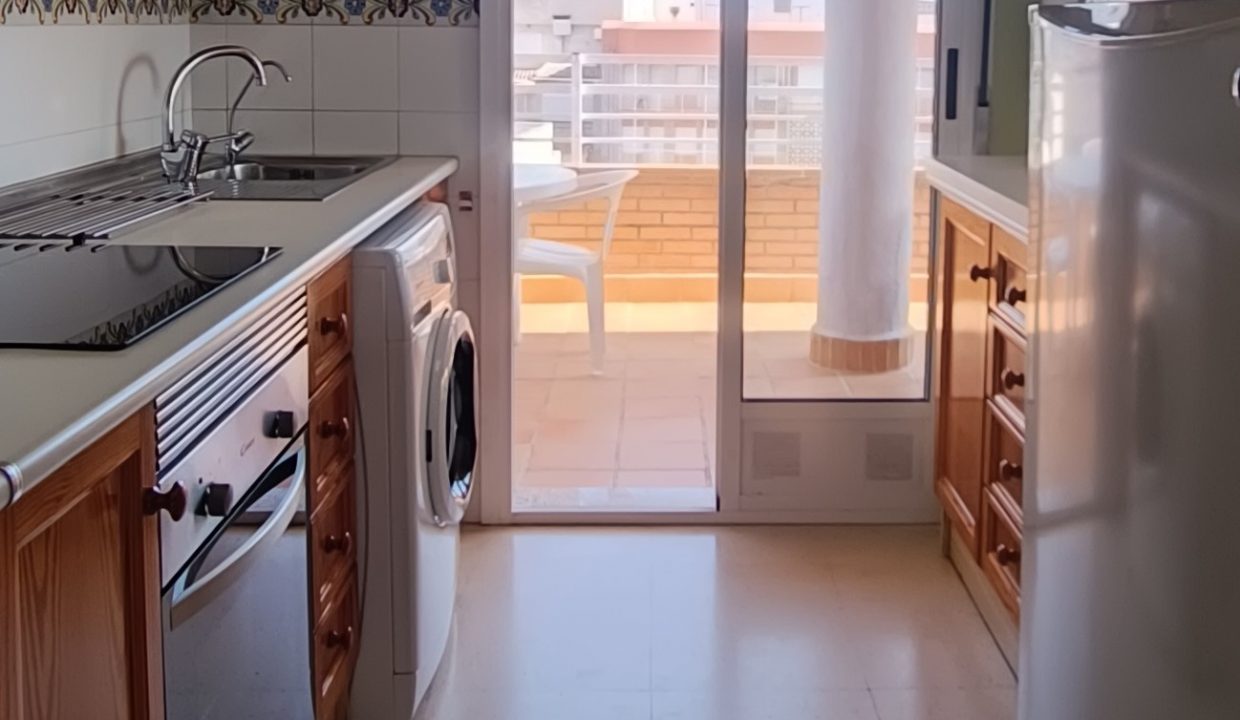 kitchen opens to the balcony