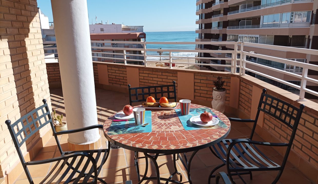 spacious terrace with multiple dining tables - image 8