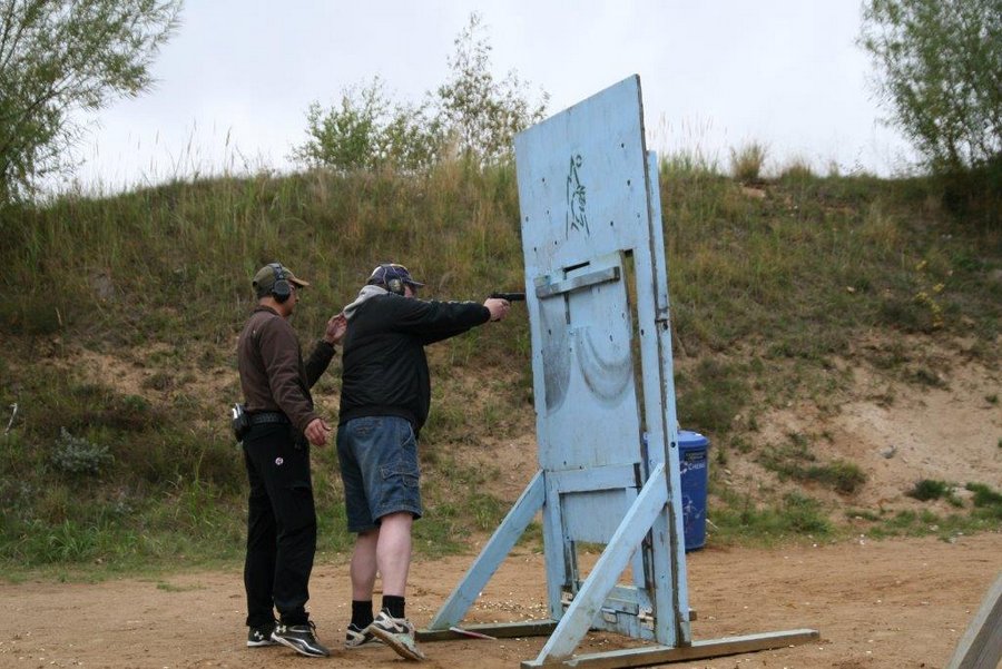 EA participant shooting around a barricade under supervision and saftey guidance by Kimu Sensei