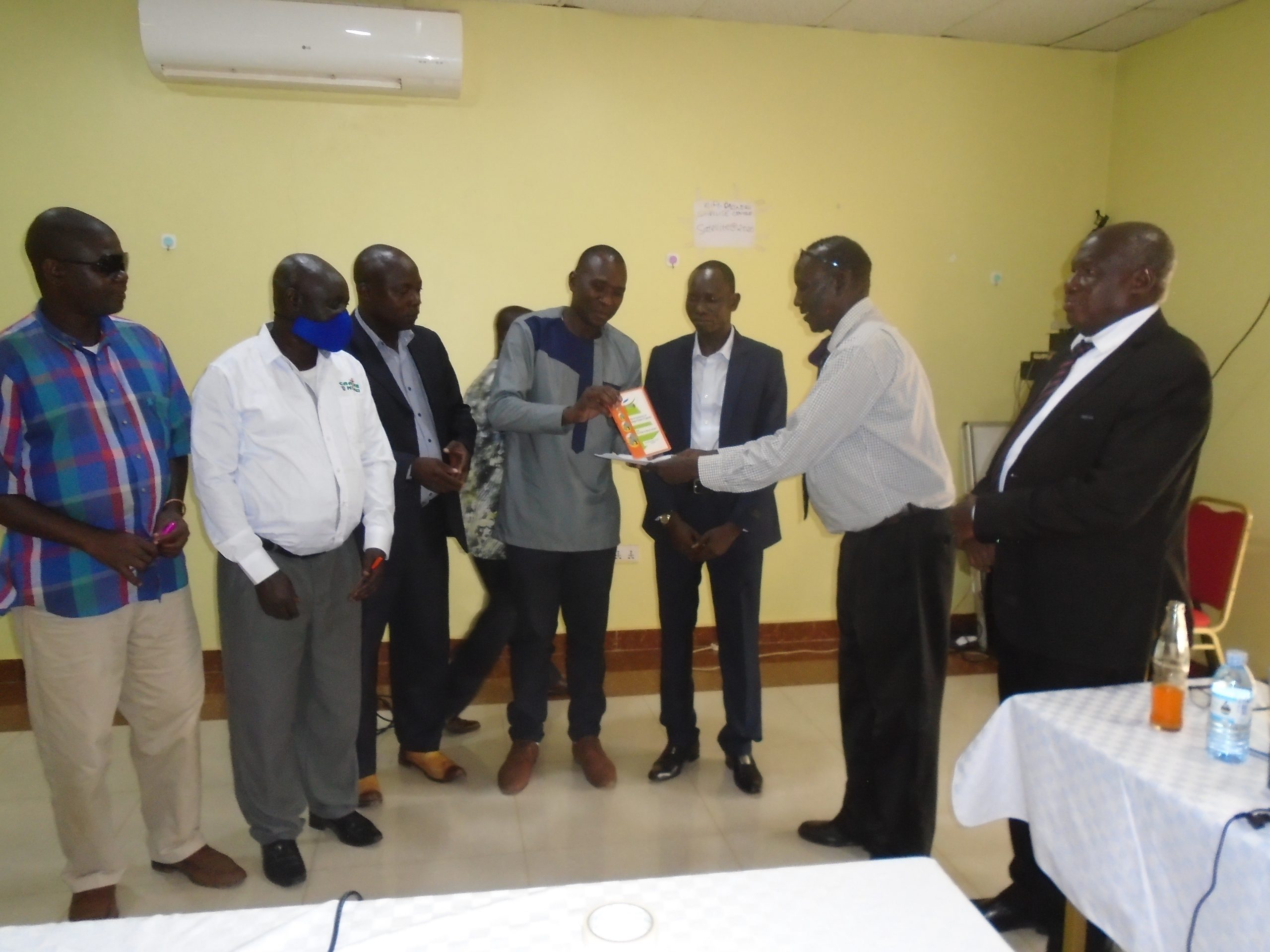 Traditional leaders from Lira handing over their marriage ordinance to the PM Ker Alur