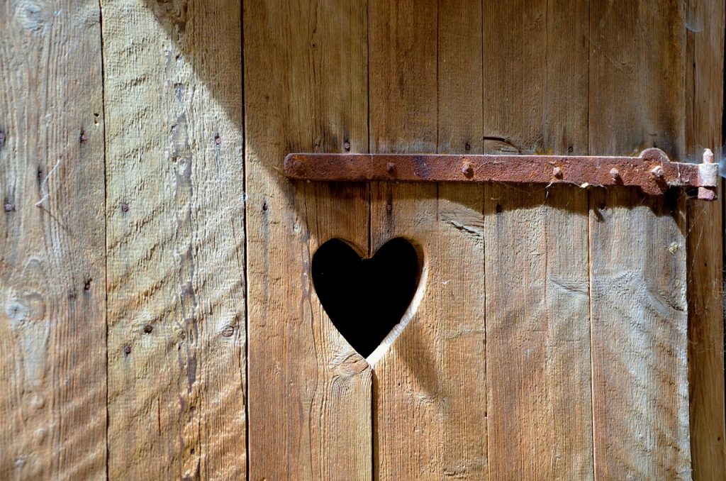 Outhouse door with a carved out heart
