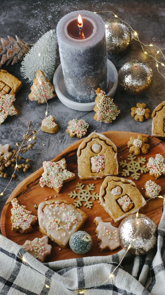 Christmas cookies shaped like houses, trees and stars