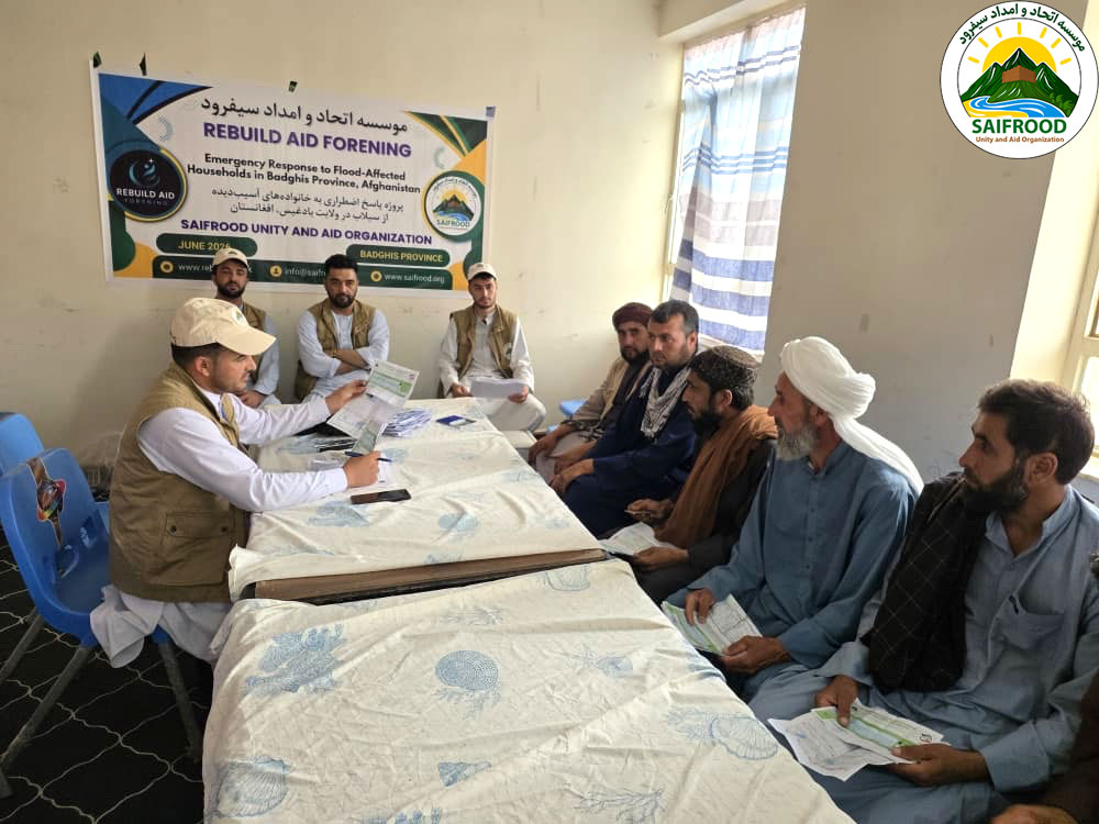 SUAO staff provide information to beneficiaries before emergency cash distribution in Badghis Province.