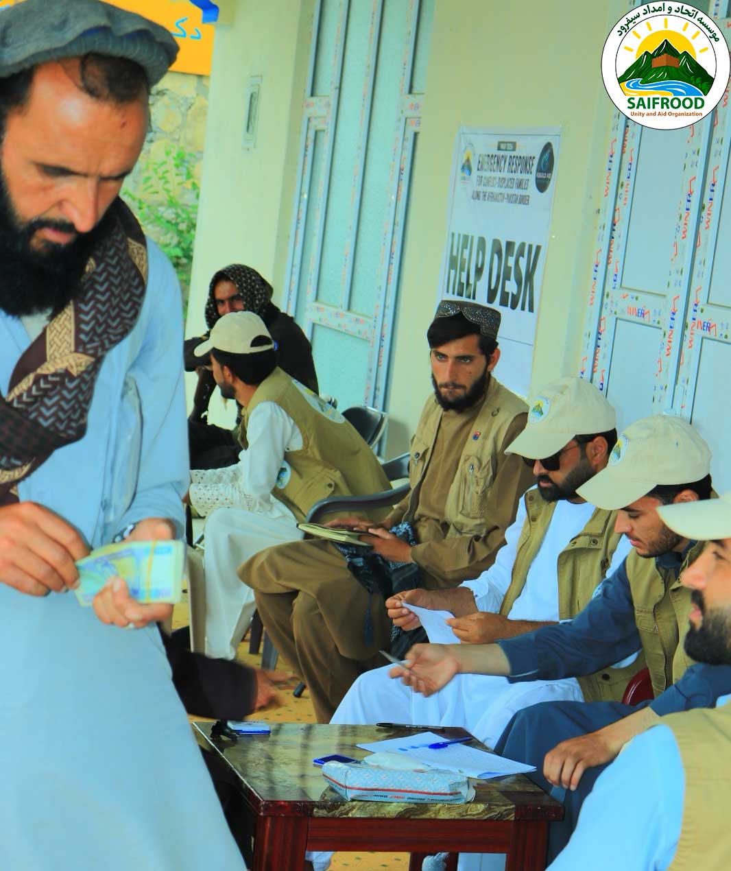 Beneficiaries waiting at the humanitarian help desk during emergency cash distribution in Khost Province.